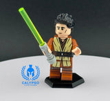 Toy figure holding a green lightsaber with Calypso Customs logo in the corner.